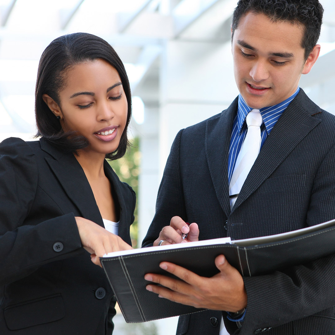 Two business partners discuss their financial plans.